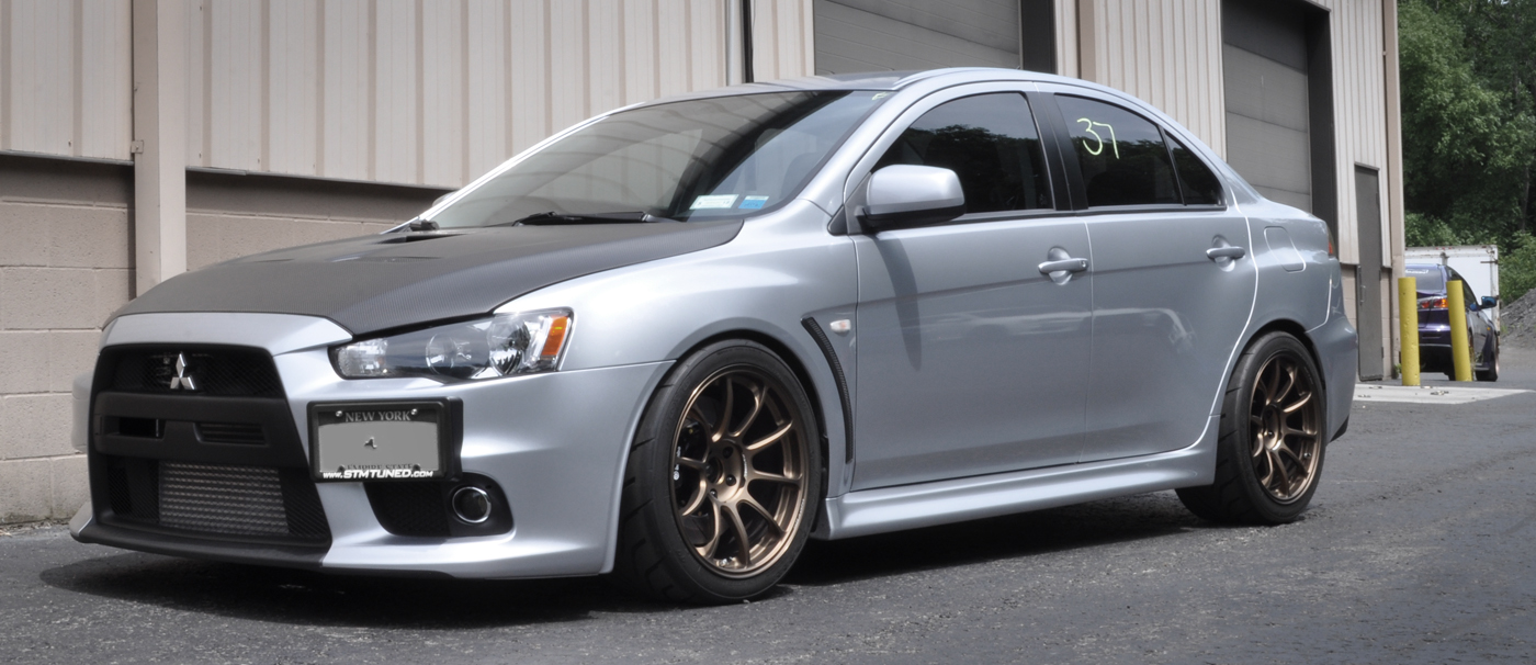 Evo X lowered with carbon fiber hood
